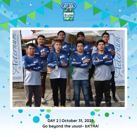 The rider and operations crew in bXTRA.PH jerseys, photographed together at the pop-up.