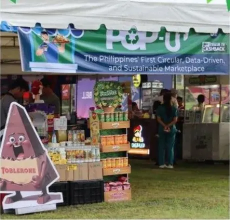 A stall trading under a banner reading The Philippines' First Circular, Data-Driven, and Sustainable Marketplace.