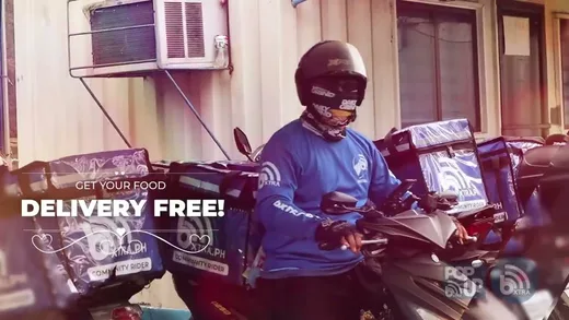 A bXTRA community rider on a motorbike loaded with insulated delivery boxes, captioned "Get your food delivery free".